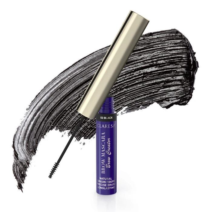 Tubka tuszu do rzęs Claresa Brow Mascara z otwartą różdżką, umieszczona przed dużą czarną smugą tuszu do rzęs.