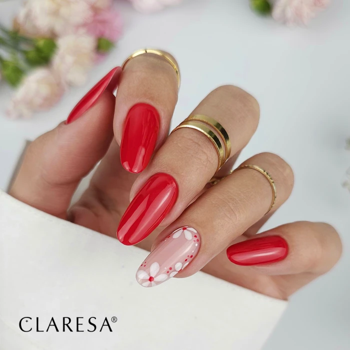 Czerwone paznokcie w kwiatki – romantyczny manicure hybrydowy Claresa z białymi zdobieniami.webp